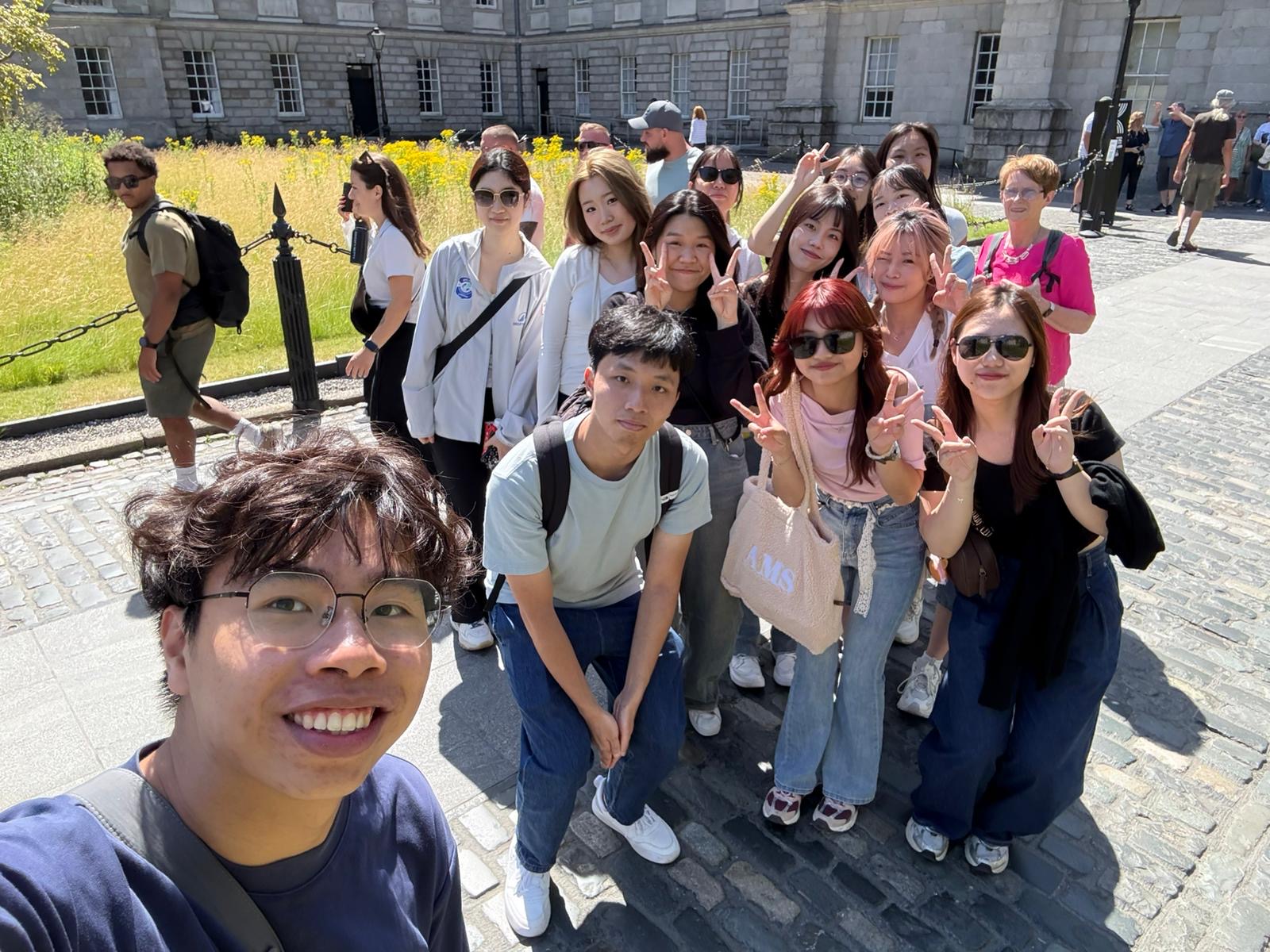Group selfie of Bloom of Youth interns exploring Trinity College Dublin