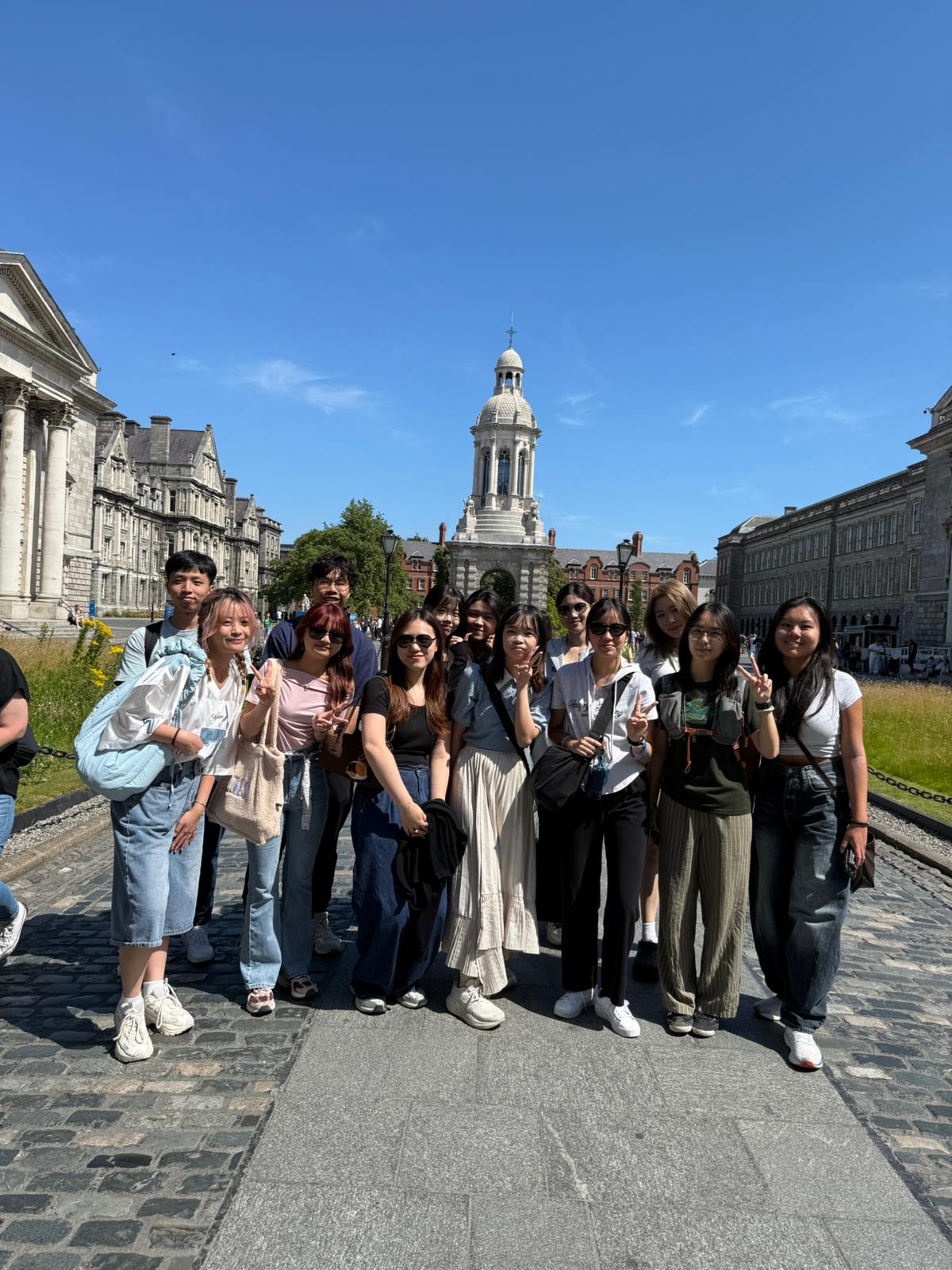 Bloom of Youth interns at Trinity College Dublin campus square on a sunny day