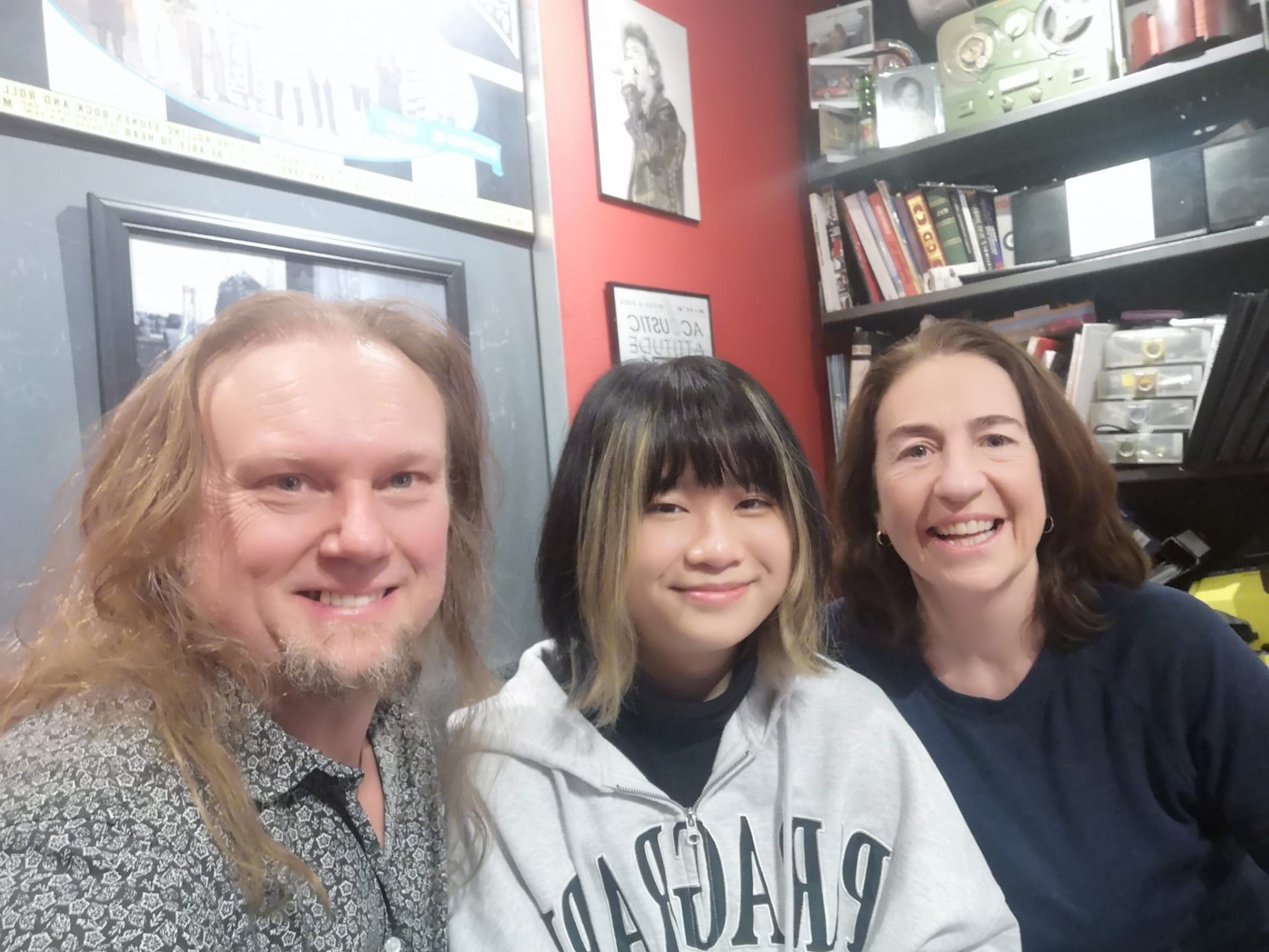 Alumna with her supervisors at a music and media production studio