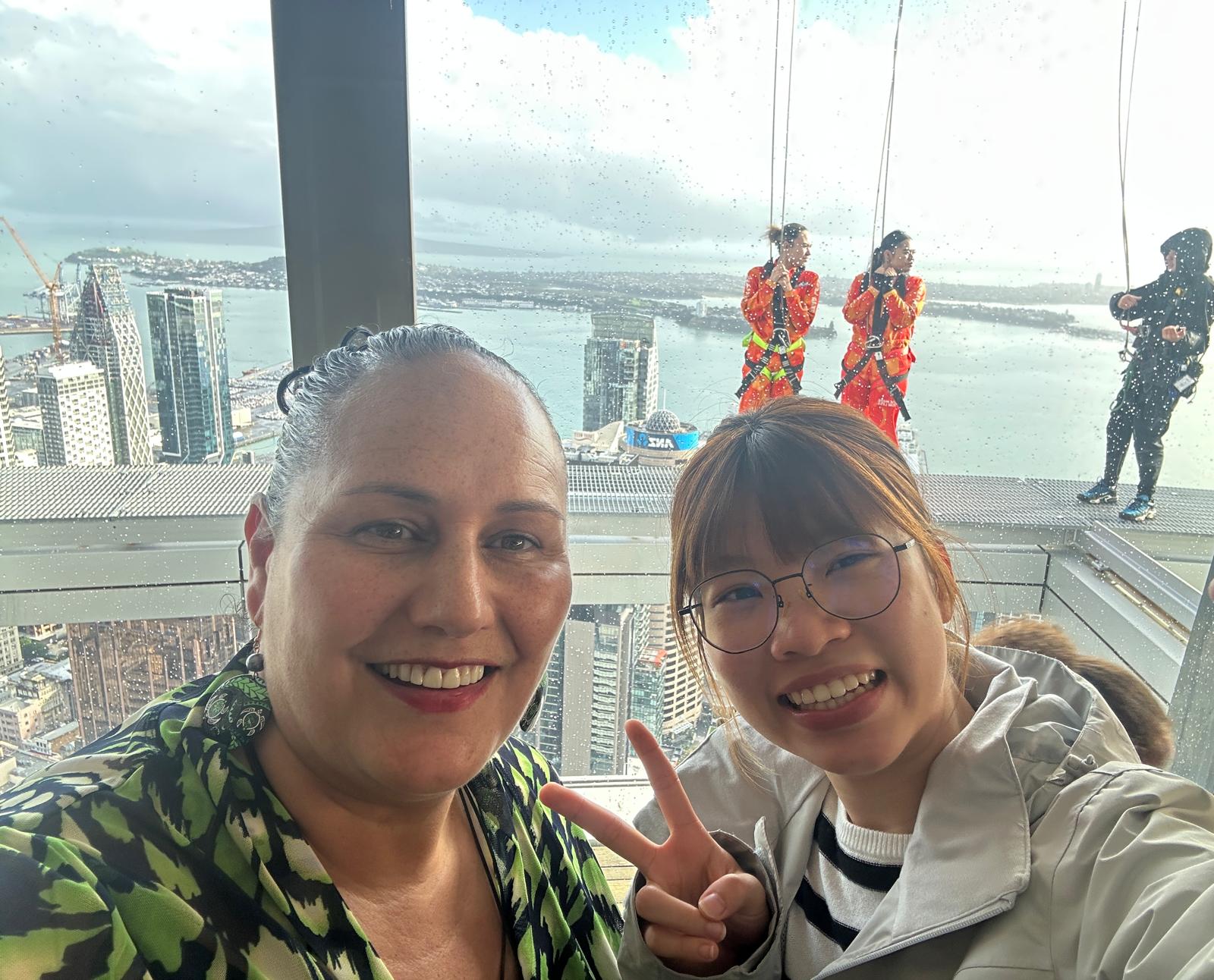 Alumna with her host mentor at the Sky Tower observation deck in Auckland